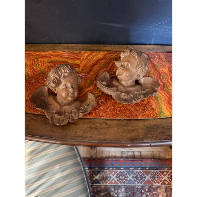 19th century carved walnut hanging cherub pair. Excellent condition.