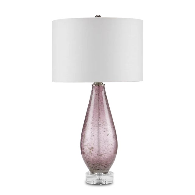 The Optimist Purple Table Lamp is made of muted lavender mouth-blown glass with speckled artisanal patterns running along...