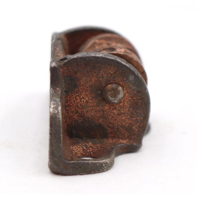 Antique bronze finish cast iron recessed window sash pulley used for double hung windows. The original mounting screws are...
