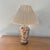 A stunning, oversized vintage chinoiserie porcelain table lamp featuring vibrant botanical and fruit decoration,...