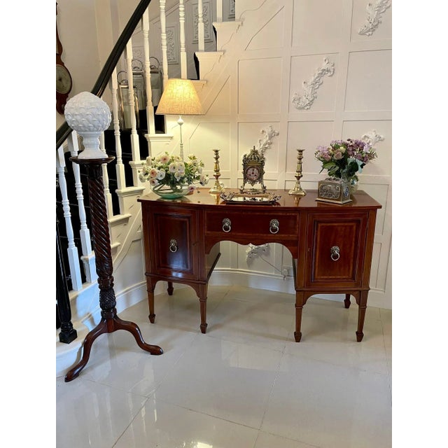 Quality antique Edwardian inlaid mahogany bow fronted sideboard having a quality mahogany top with pretty satinwood...