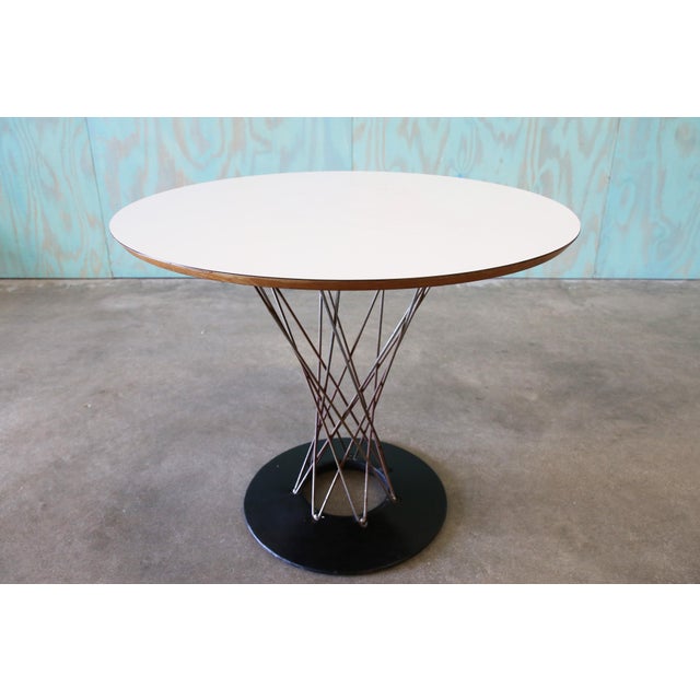 Iconic cyclone table designed by Isamu Noguchi and produced by Knoll Associates. This early table features a cast iron...