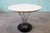 Iconic cyclone table designed by Isamu Noguchi and produced by Knoll Associates. This early table features a cast iron...