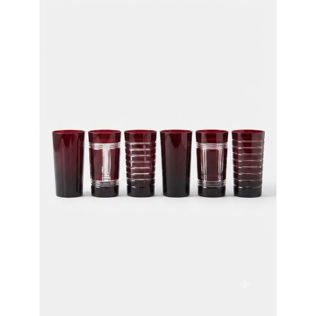 Six Ruby Red,cut-to clear crystal glass set features an elegant mix of geometric patterns. The precise cuts reveal...