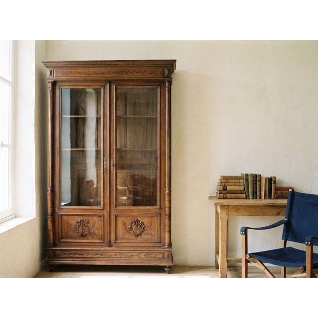 A 19th century French Louis XVI bibliotheque, or bookcase, made of solid walnut with mahogany as a secondary wood. Nice...