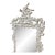 Large Rococo style carved wall mirror featuring ornate scrollwork, floral details, and sculptural elements. Finished in...