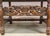 A mid 20th century Jacobean Revival Style three-seat settee, finely crafted in richly patinated hardwood and displaying...