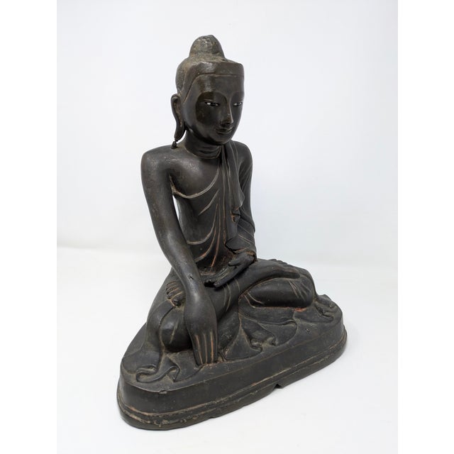 Traveling Man Treasures is selling this bronze Burmese Mandalay-style seated Buddha statue, likely dating from the late...