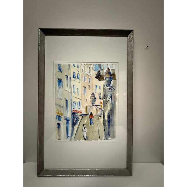 European street scene print with distressed silver frame.
