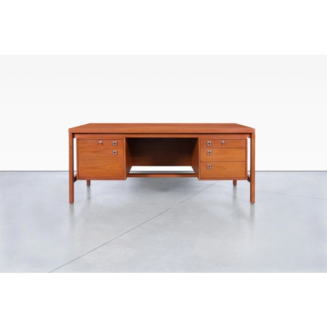 Designed by the celebrated designer Arne Vodder and crafted by H.P. Hansen, this Danish Modern executive desk is a...