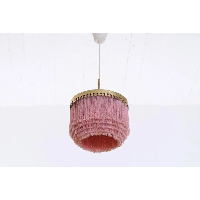 Brass and silk fringes. Produced by Hans-Agne Jakobsson, Markaryd, Sweden, 1960s. Measures: Diameter 28 cm, height is...