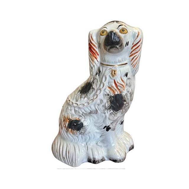 Beautiful English Victorian tricolor Staffordshire spaniel dog figurine. The hand painting, soft gilding, kiln fire hole...