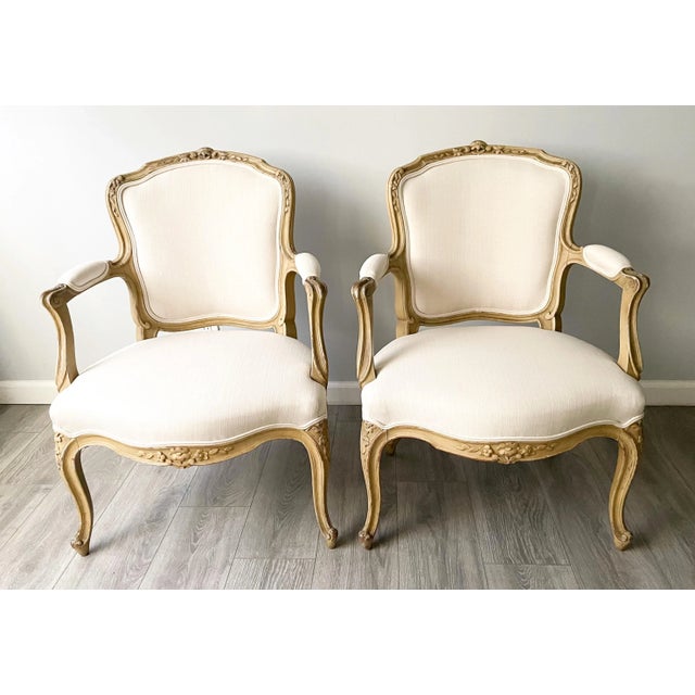 Beautiful, French 1920s petite-scale, Louis XV-style painted armchairs. The chairs feature beautifully carved frames...