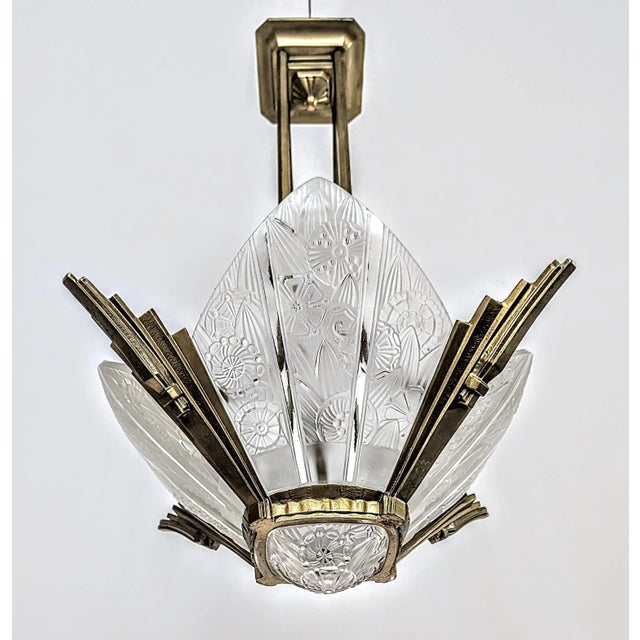 A rare French Art Deco chandelier Signed by the French Artist " Hettier Vincent ". Four side panels with a center shade in...