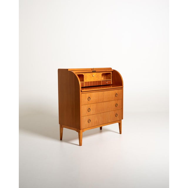Elm and burl wood secretary desk with drop-leaf, three large drawers, and internal compartments. Scandinavian production,...