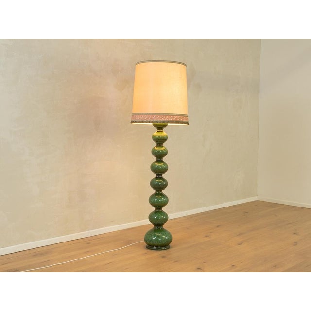 Exclusive Bubble floor lamp by Kaiser Leuchten from the 1960s. Handcrafted glazed ceramic base in shades of green with a...