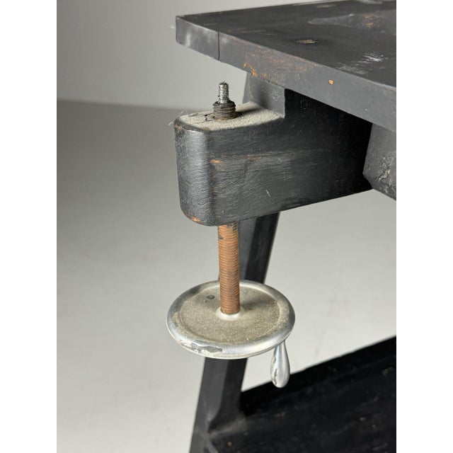 French column / sculpture stand. Crafted from pine wood. Painted black. Standing on wheels. The swivel mechanism causes...