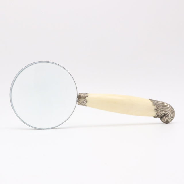 A fine sterling silver and bone magnifying glass from England 1894. Stamped with makers marks.