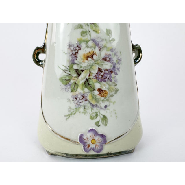 An elegant Art Nouveau porcelain vase dating from the turn of the 20th century, circa 1890–1910. This Jugendstil-inspired...