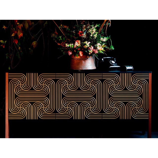 The loop sideboard three door with emerald, black, blue or red doors. This piece will add a contemporary art deco elegance...