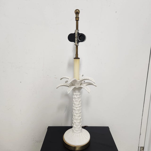 Bring effortless Palm Beach Regency glamour to your space with this striking vintage white porcelain palm tree table lamp....