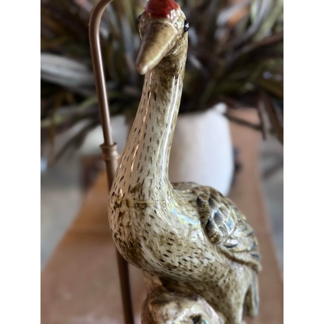 A sculptural pair of vintage figural crane table lamps featuring beautifully detailed featherwork, long, elegant necks,...