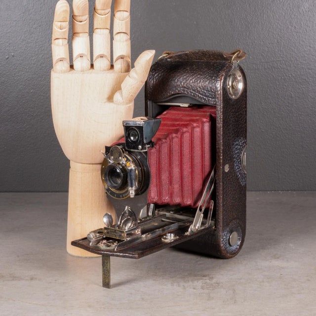 ABOUT An original large Eastman Kodak No. 2C folding pocket camera with red bellows. The body is wrapped in leather with...