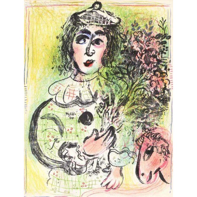 Artist: Marc Chagall Title: The Clown with Flowers Medium: Original Lithograph Marks: Not signed, not numbered Printed:...