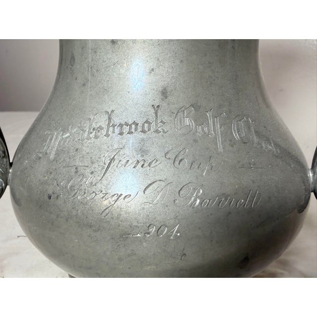 Up for sale is a rare antique 1904 pewter golf trophy vase. This lovely 3 handle style trophy by Manning Bowman has a...