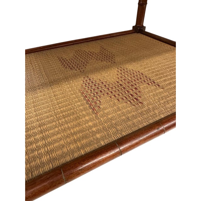 This Vintage Chinese Chippendale Two-Tiered Rattan and Bamboo Table is a timeless piece that brings both elegance and...