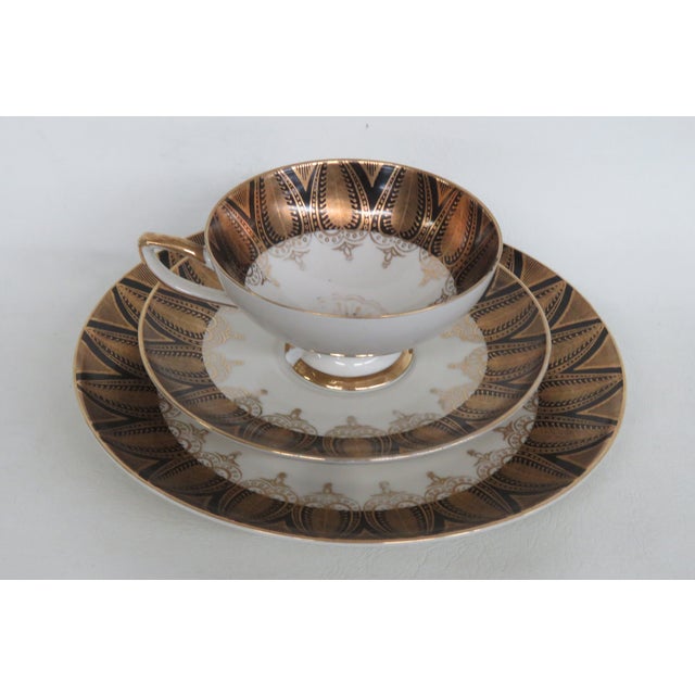 This lovely 3pc Set is made out of porcelain. This gorgeous set is stamped on the bottom as being made by H.M.S. Royal...