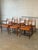 This set of six dining chairs features an elegant organic profile with sculpted slatted backrests. It includes four...