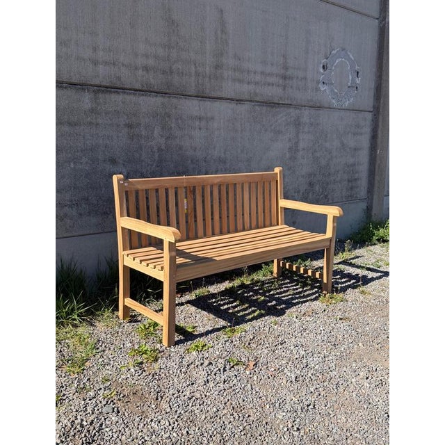 Timeless solid teak garden bench in the “classic” model. Featuring a clean slatted design and a gently curved backrest,...