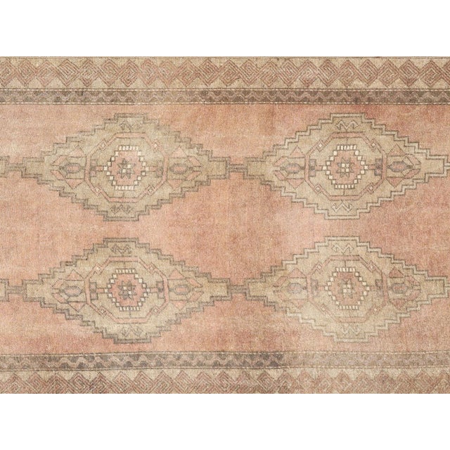 Handwoven vintage Turkish Oushak runner measuring 3'7" x 9'8". Crafted with wool on wool foundation in Western Turkey's...