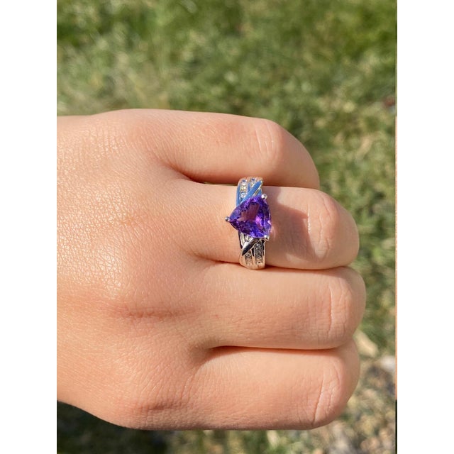 The Eldridge: Ladies 14K Trilliant Cut Amethyst and Diamond Cocktail Ring. Crafted in 14 karat white gold, this ladies...