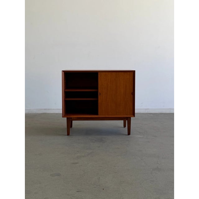 W31.5 D18 H28.5 A beautifully restored vintage teak cabinet attributed to Poul Cadovius, showcasing the clean lines and...