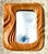 This exceptional vintage mirror is a masterclass in organic modernism, featuring a hand-carved frame that flows with...