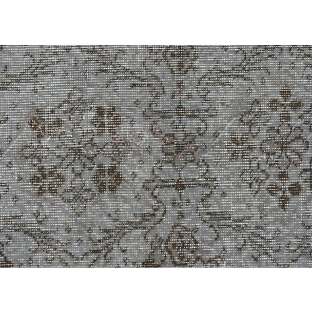 Expertly hand-woven in Turkey with a wool on cotton foundation, this Vintage Turkish OverDyed Rug has been transformed...