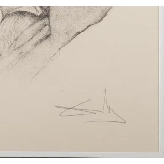 Framed limited-edition portrait of Pablo Picasso by Salvador Dalí. Pencil signed and numbered 136/250 in the lower margin....