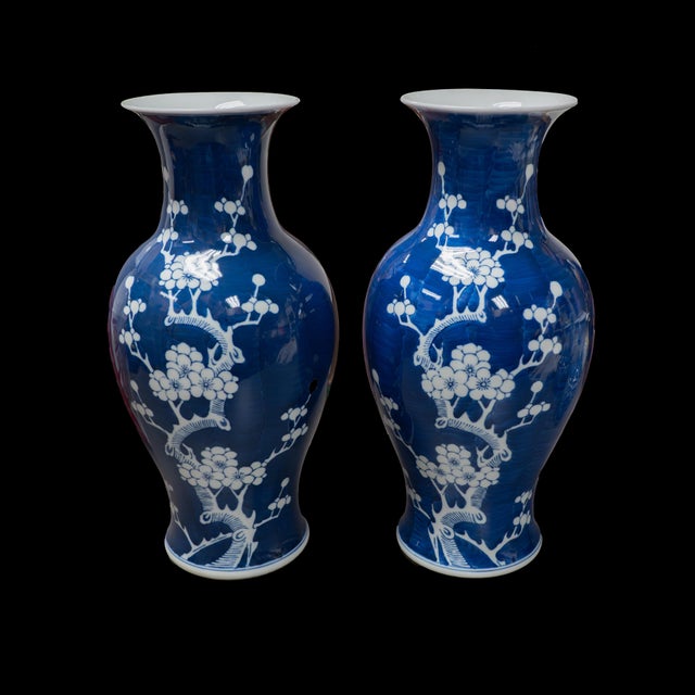 Vintage Chinese hand painted, blue and white Jingdezhen Jiangxi Porcelain floral, celestial shaped pair of vases. The...