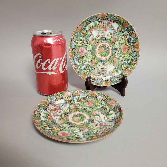 Pair of vibrant early 1940's era hand-painted Rose Medallion porcelain plates with a distinctive blue fret key border that...