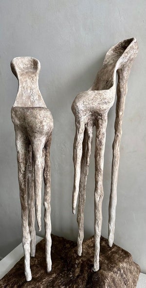 The First Shoes by Cor Oda | Plaster and Steel Sculpture of two abstract shoes