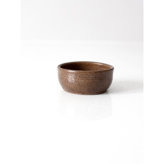 A vintage handmade studio pottery bowl with a beautifully irregular hand-thrown form and subtle variation throughout the...