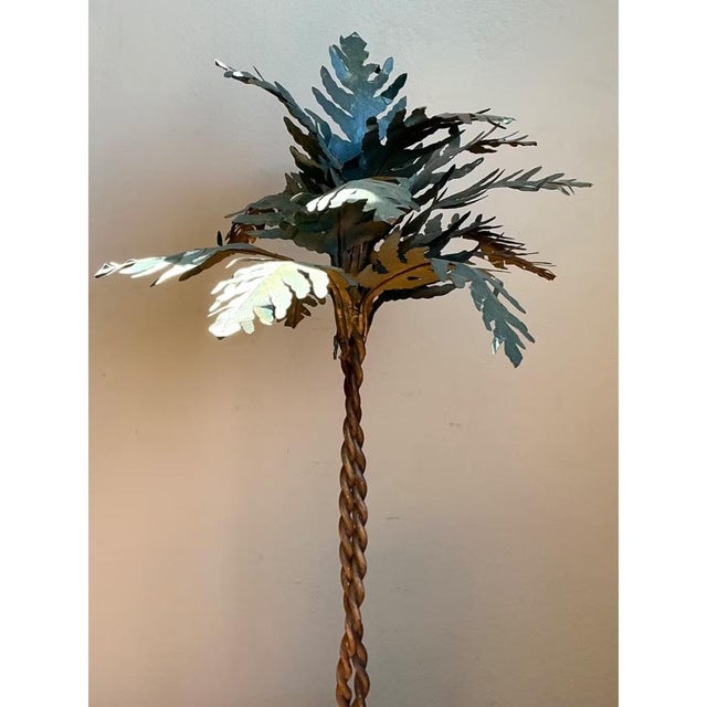 This vintage decorative metal palm tree brings a sculptural, tropical note to any interior. Crafted from metal and resin,...