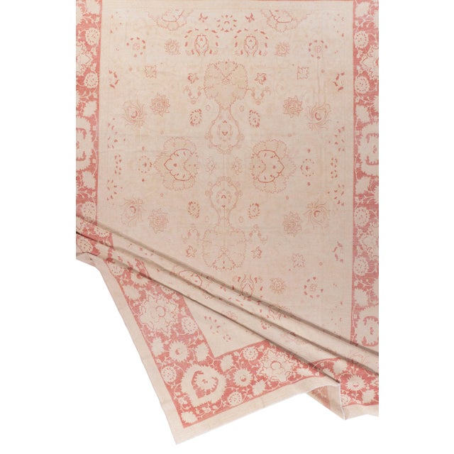 A hand knotted wool Agra design rug circa 1960. Elevate your floor with this beautiful rug! Colors: ivory/beige/taupe