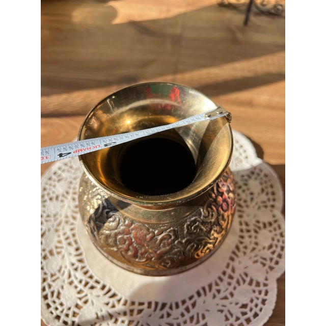 Up for consideration is a beautiful vintage brass vase with hand hammered details. This would look lovely in your home and...