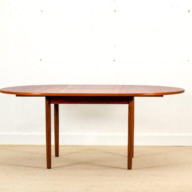 A beautiful round Mid-Century dining table, made in Denmark in 1960 , crafted from teak with a particularly warm and...