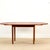 A beautiful round Mid-Century dining table, made in Denmark in 1960 , crafted from teak with a particularly warm and...