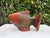 Hand-carved wooden fish sculpture featuring a multitone stained finish that highlights the carved scales, fins, and...