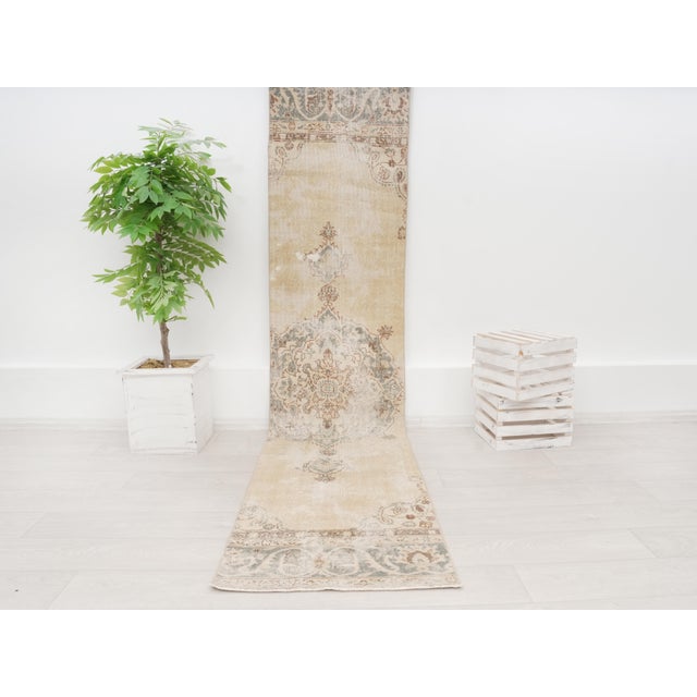 Enhance your home decor with this authentic vintage Turkish runner rug, hand-knotted from 100% natural organic wool....